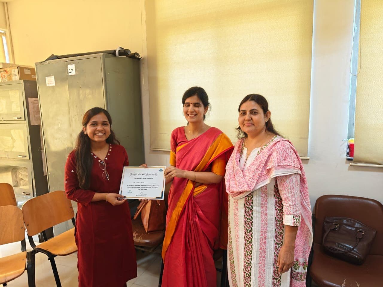 Dr. Neha Shukla presenting certificate — graduate 20