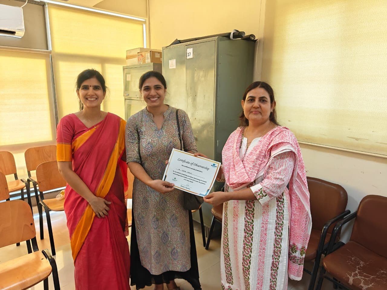 Dr. Neha Shukla presenting certificate — graduate 28